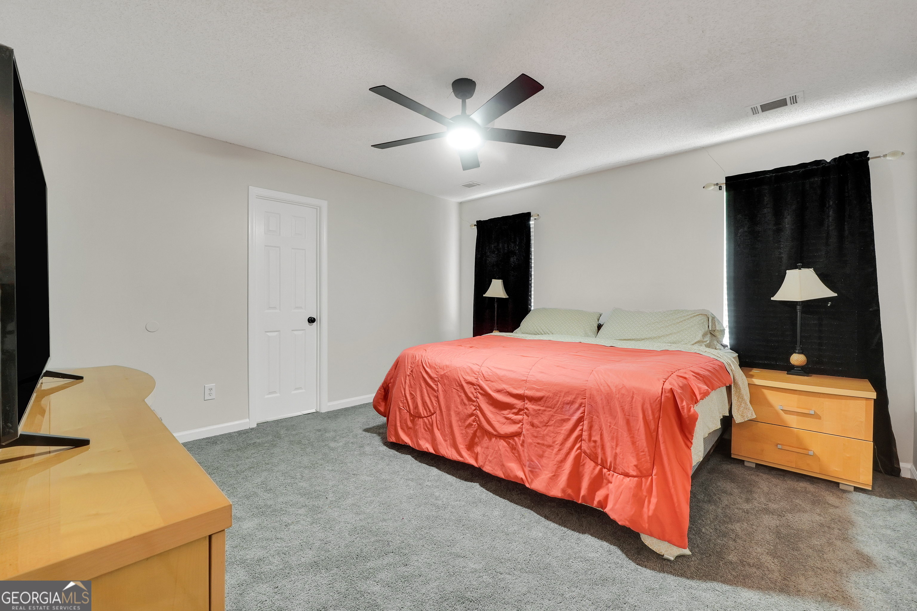 110 Westeria Way Jackson, GA 30233 - Photo 15 of 45 a bed room with a bed and a window