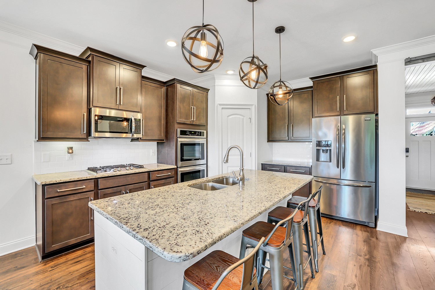 1142 Batbriar Road Murfreesboro, TN 37128 - Photo 14 of 60 a kitchen with stainless steel appliances granite countertop a sink refrigerator stove and microwave