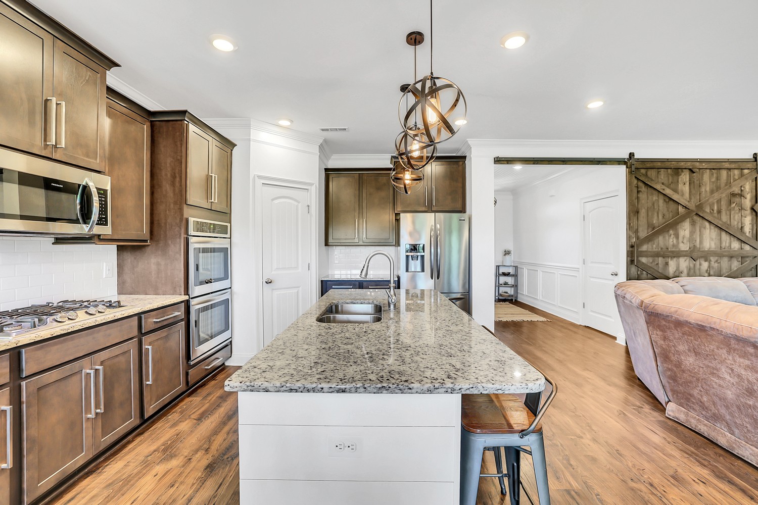 1142 Batbriar Road Murfreesboro, TN 37128 - Photo 16 of 60 a kitchen with stainless steel appliances granite countertop a sink a stove and refrigerator