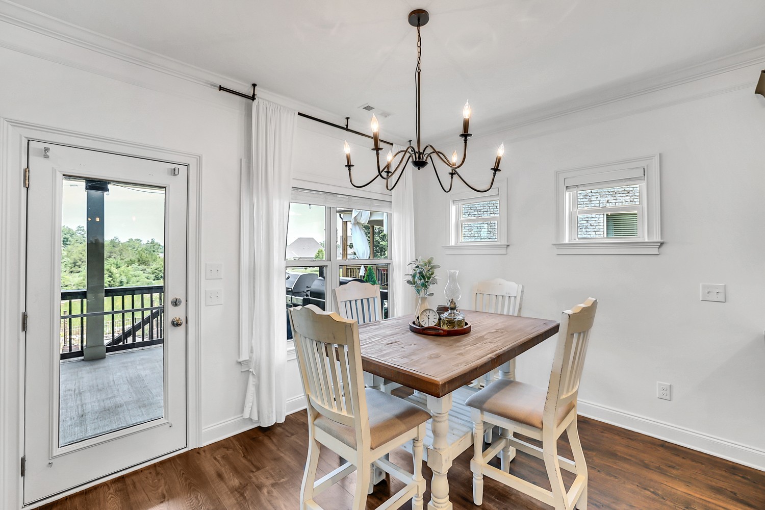 1142 Batbriar Road Murfreesboro, TN 37128 - Photo 20 of 60 a view of a dining room with furniture wooden floor and chandelier