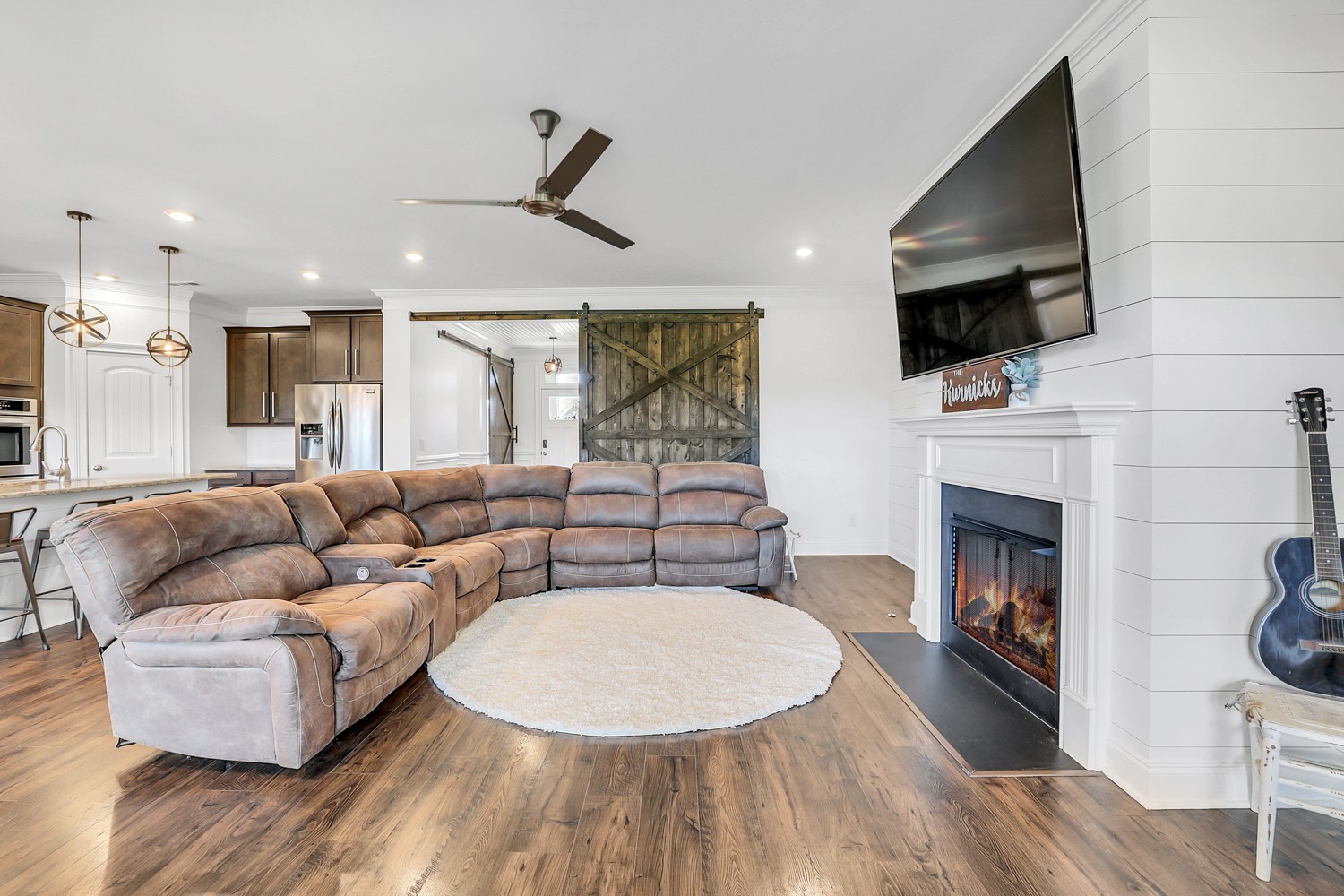 1142 Batbriar Road Murfreesboro, TN 37128 - Photo 27 of 60 a living room with furniture a fireplace and a flat screen tv