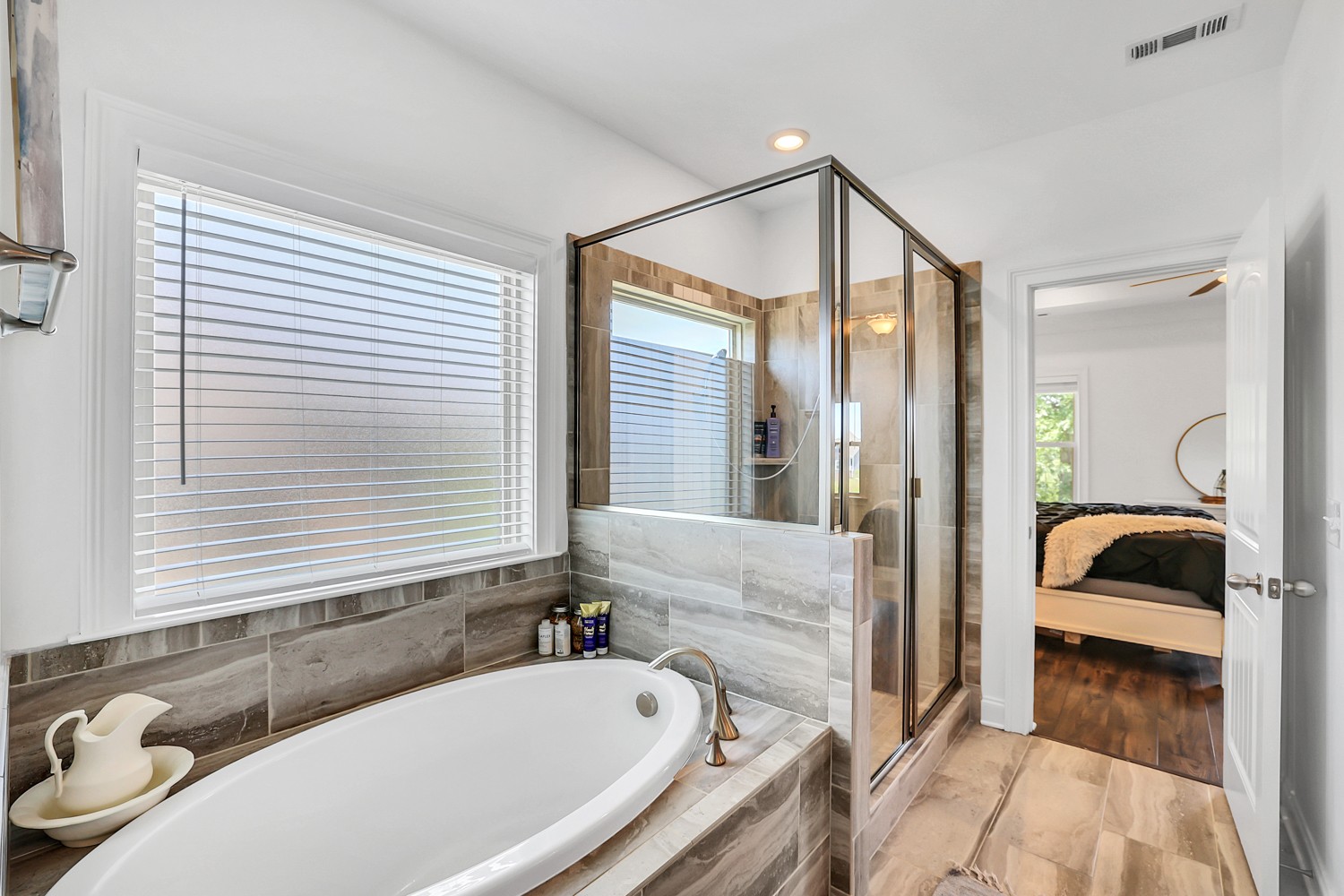 1142 Batbriar Road Murfreesboro, TN 37128 - Photo 29 of 60 a bathroom with a tub sink and mirror