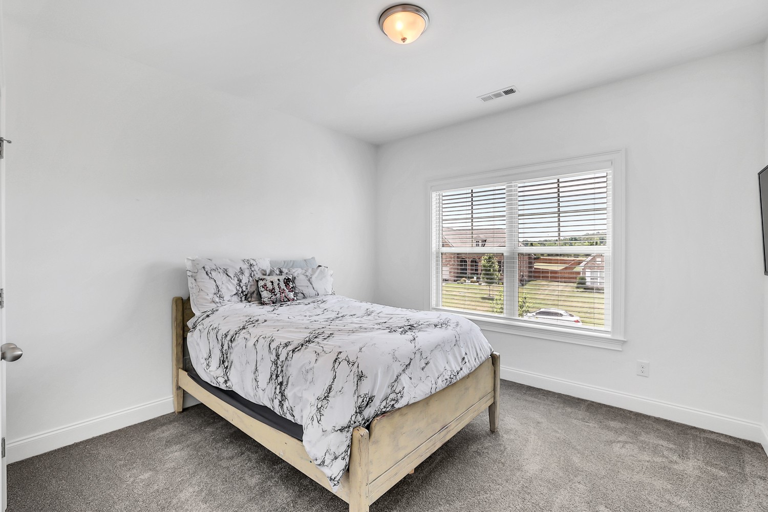 1142 Batbriar Road Murfreesboro, TN 37128 - Photo 43 of 60 a bed sitting in a bedroom next to a window