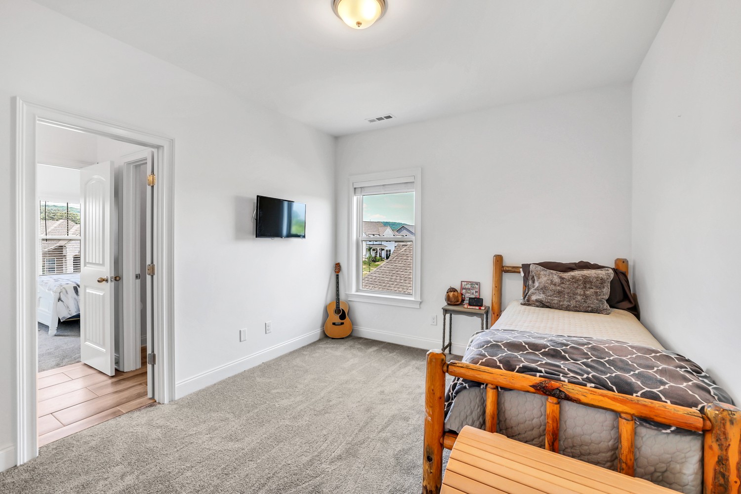 1142 Batbriar Road Murfreesboro, TN 37128 - Photo 46 of 60 a bedroom with a bed and wooden floor