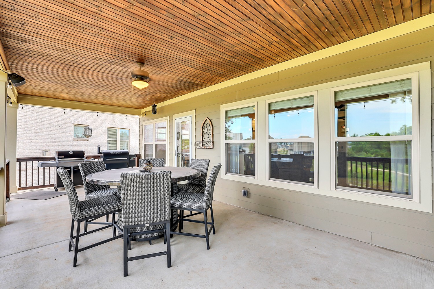 1142 Batbriar Road Murfreesboro, TN 37128 - Photo 56 of 60 a view of a dining room with furniture large windows and wooden floor