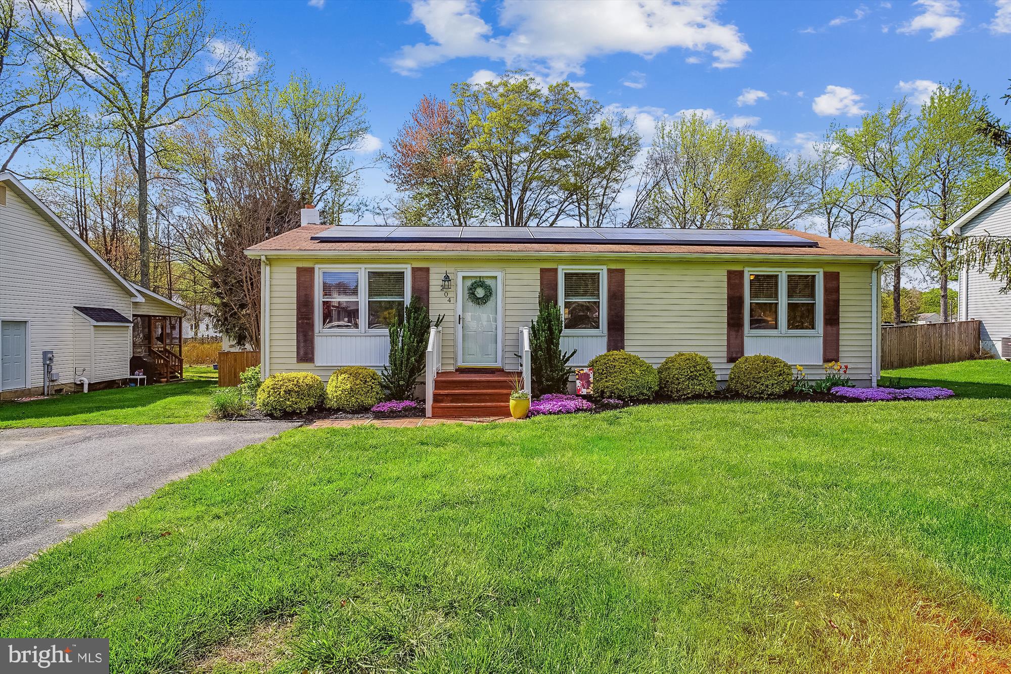 a view of a house with backyard porch and garden