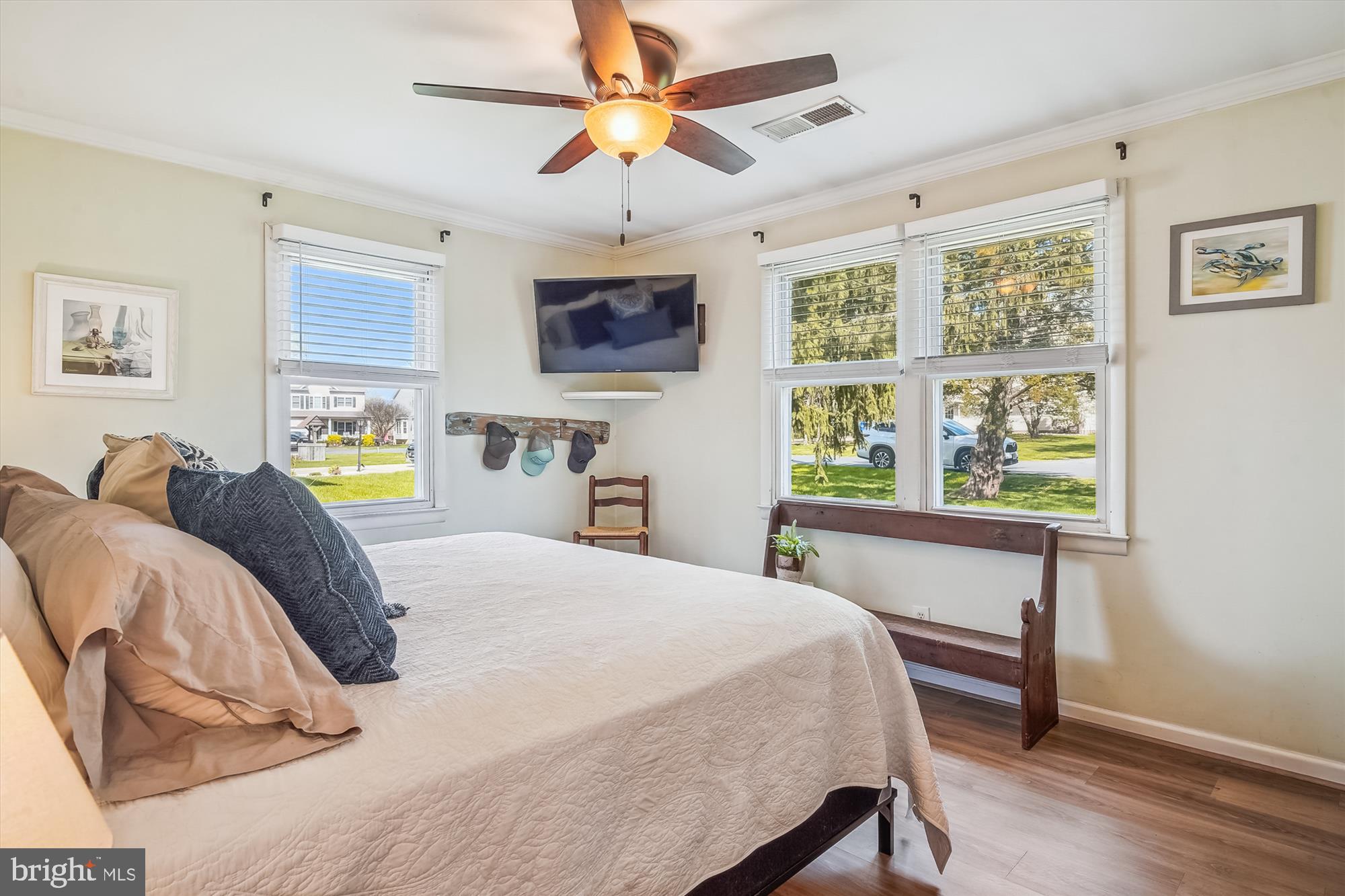 204 McKay Road Stevensville, MD 21666 - Photo 15 of 31 a bedroom with a bed a window and a chandelier