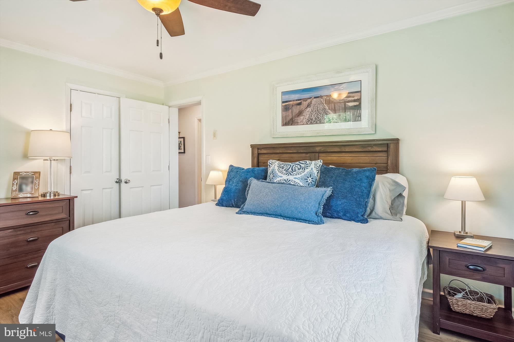 204 McKay Road Stevensville, MD 21666 - Photo 16 of 31 a bedroom with a bed and a lamp