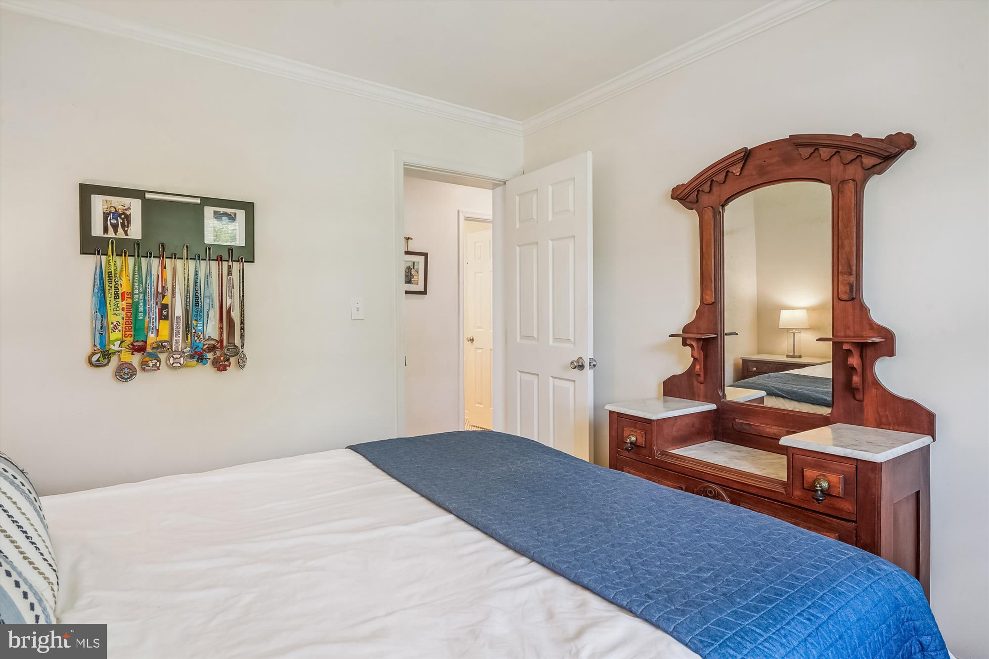204 McKay Road Stevensville, MD 21666 - Photo 18 of 31 a bedroom with a bed and wooden floor