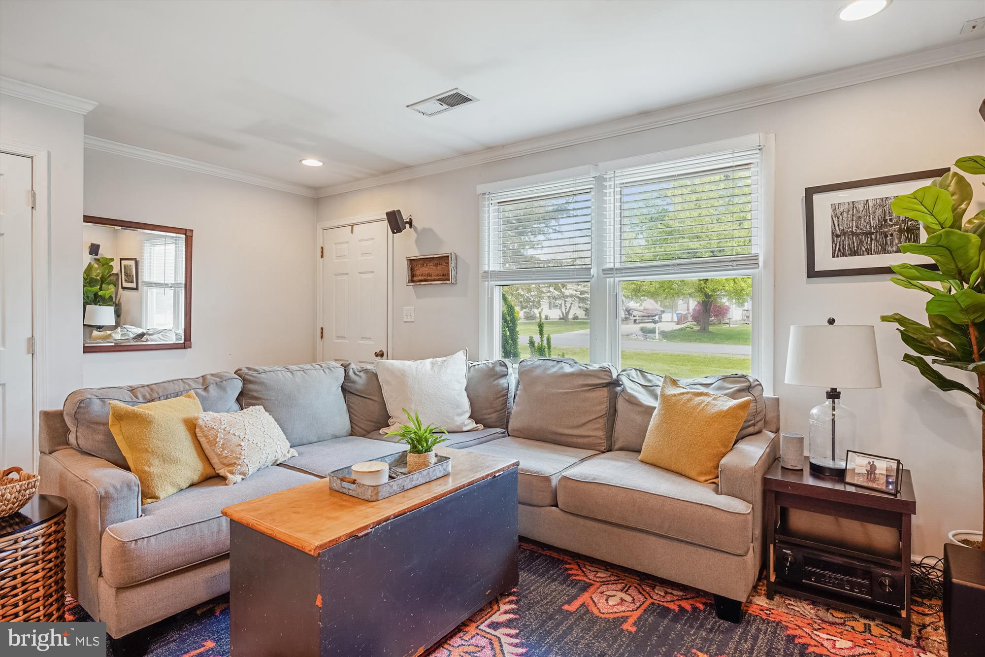 204 McKay Road Stevensville, MD 21666 - Photo 7 of 31 a living room with furniture and a large window