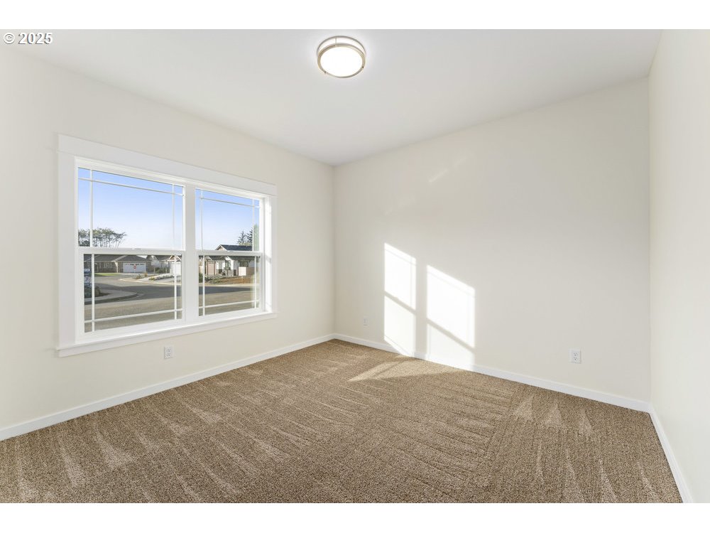 1241 Lighthouse Lane Brookings, OR 97415 - Photo 8 of 32 a view of an empty room with a window