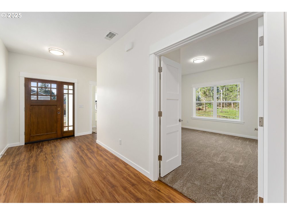 1241 Lighthouse Lane Brookings, OR 97415 - Photo 10 of 32 a view of an empty room with a window