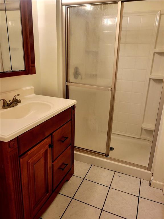 676 Davidson Drive Rochester, PA 15074 - Photo 20 of 24 a bathroom with a sink a mirror and a shower
