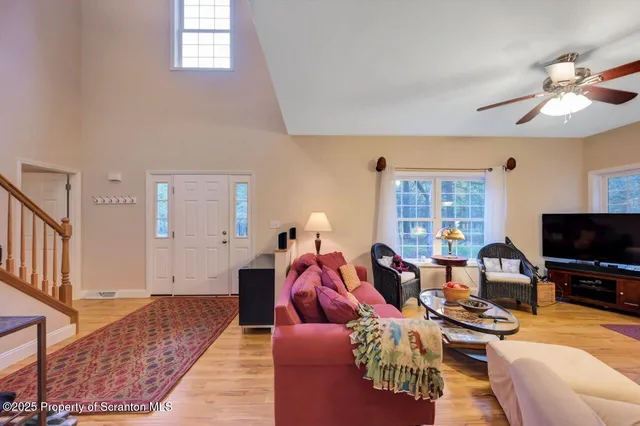 a view of a dining room with furniture and chandelier