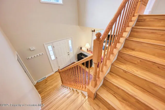 a bedroom with a bed ceiling fan and a window