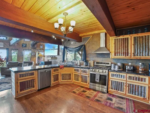 a view of a kitchen with furniture and a kitchen
