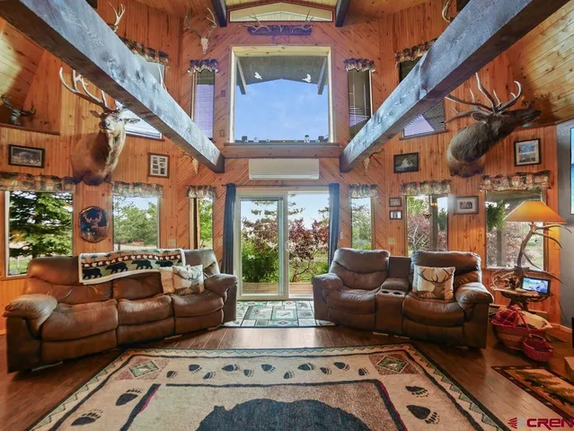 a bedroom with furniture and a chandelier