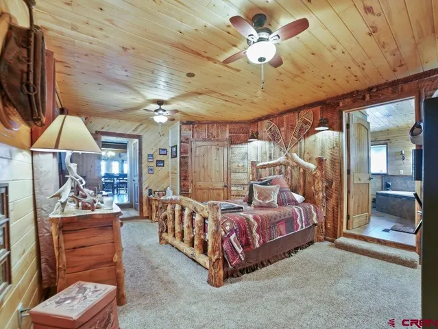 a bathroom with a tub a sink and a shower