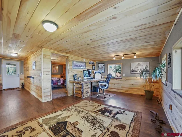 a bedroom with a bed and ceiling fan