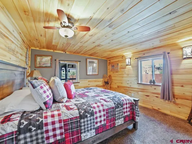 a view of a patio with table and chairs and wooden floor