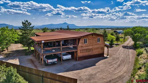 an aerial view of a house with a garden