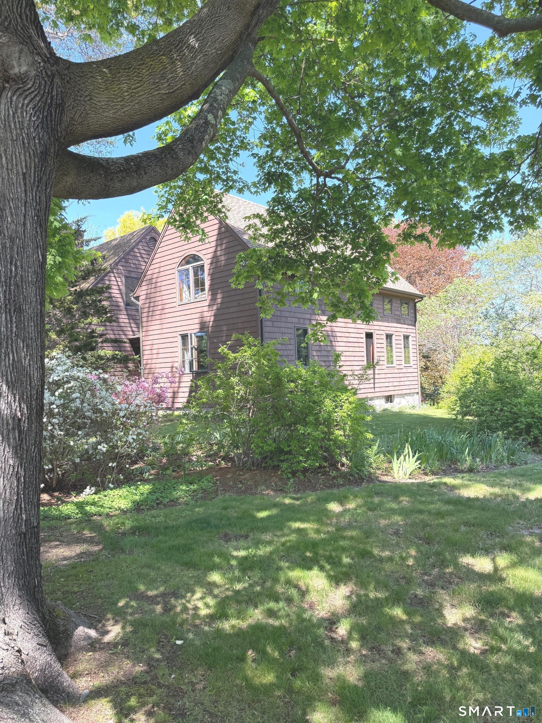 8 Ivy Road Stonington, CT 06355 - Photo 2 of 30 a view of a house with a yard