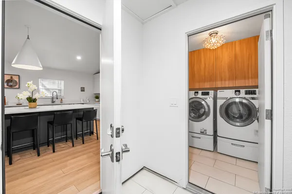 a view of a hallway with washer and dryer