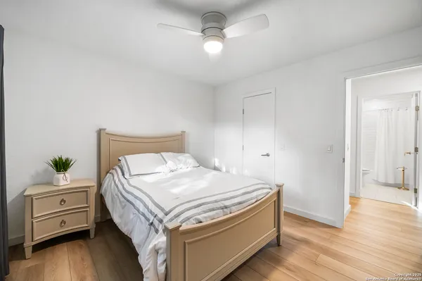 a bedroom with a bed and a dresser