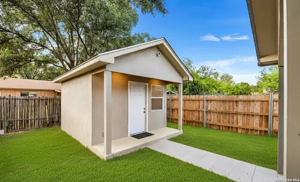 a view of backyard with green space