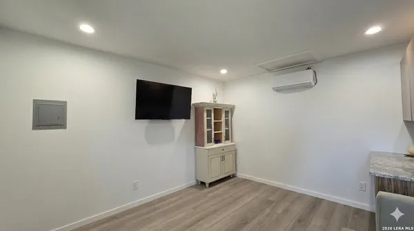 a view of a livingroom with wooden floor