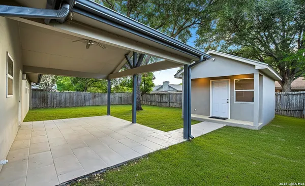 a view of backyard with large trees