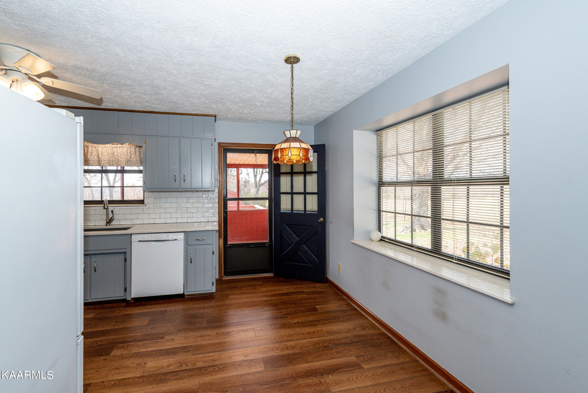 913 Mt Lebanon Road Maryville, TN 37804 - Photo 11 of 33 a view of an empty room with a window and wooden floor
