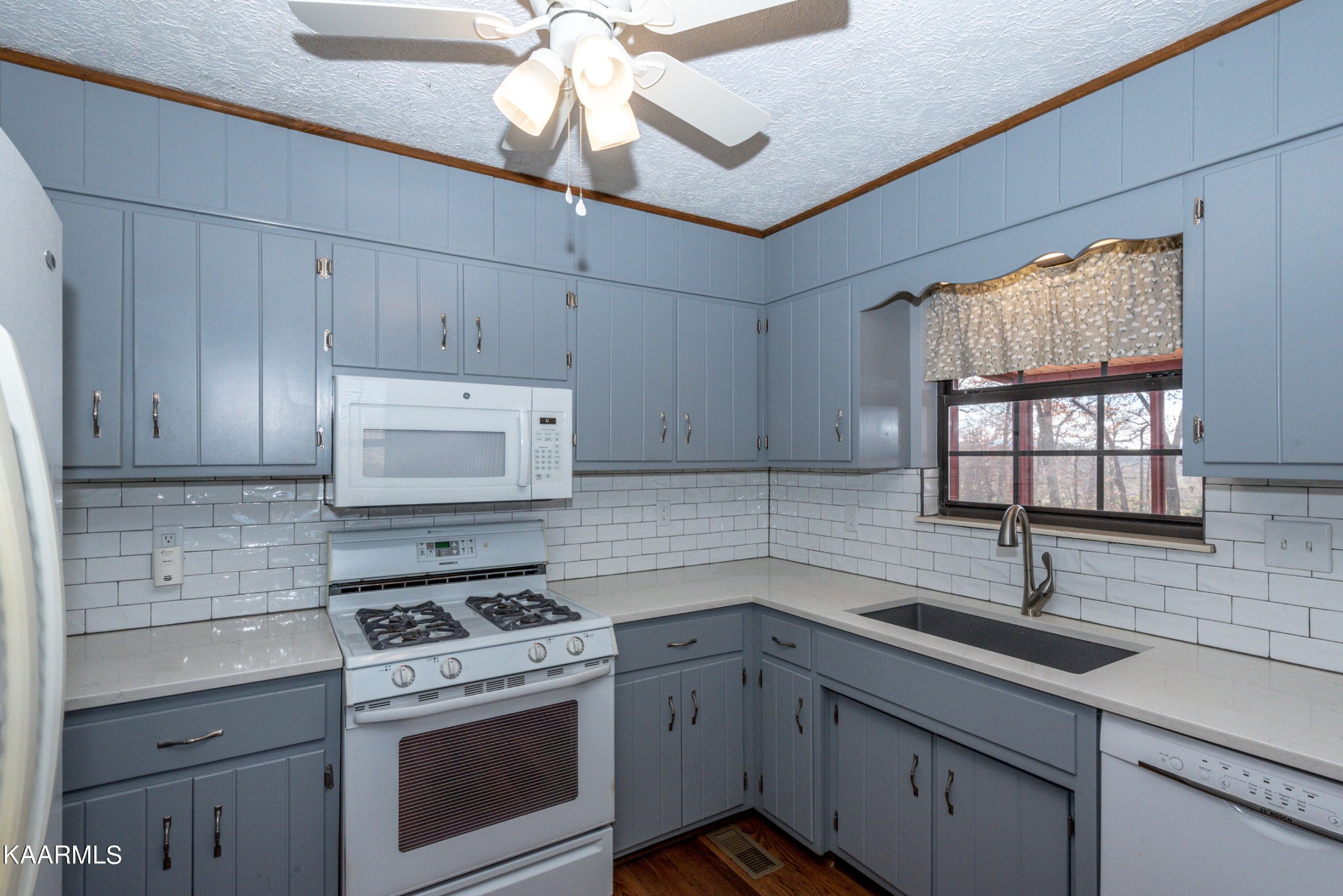 913 Mt Lebanon Road Maryville, TN 37804 - Photo 14 of 33 a kitchen with cabinets stainless steel appliances a sink and a window