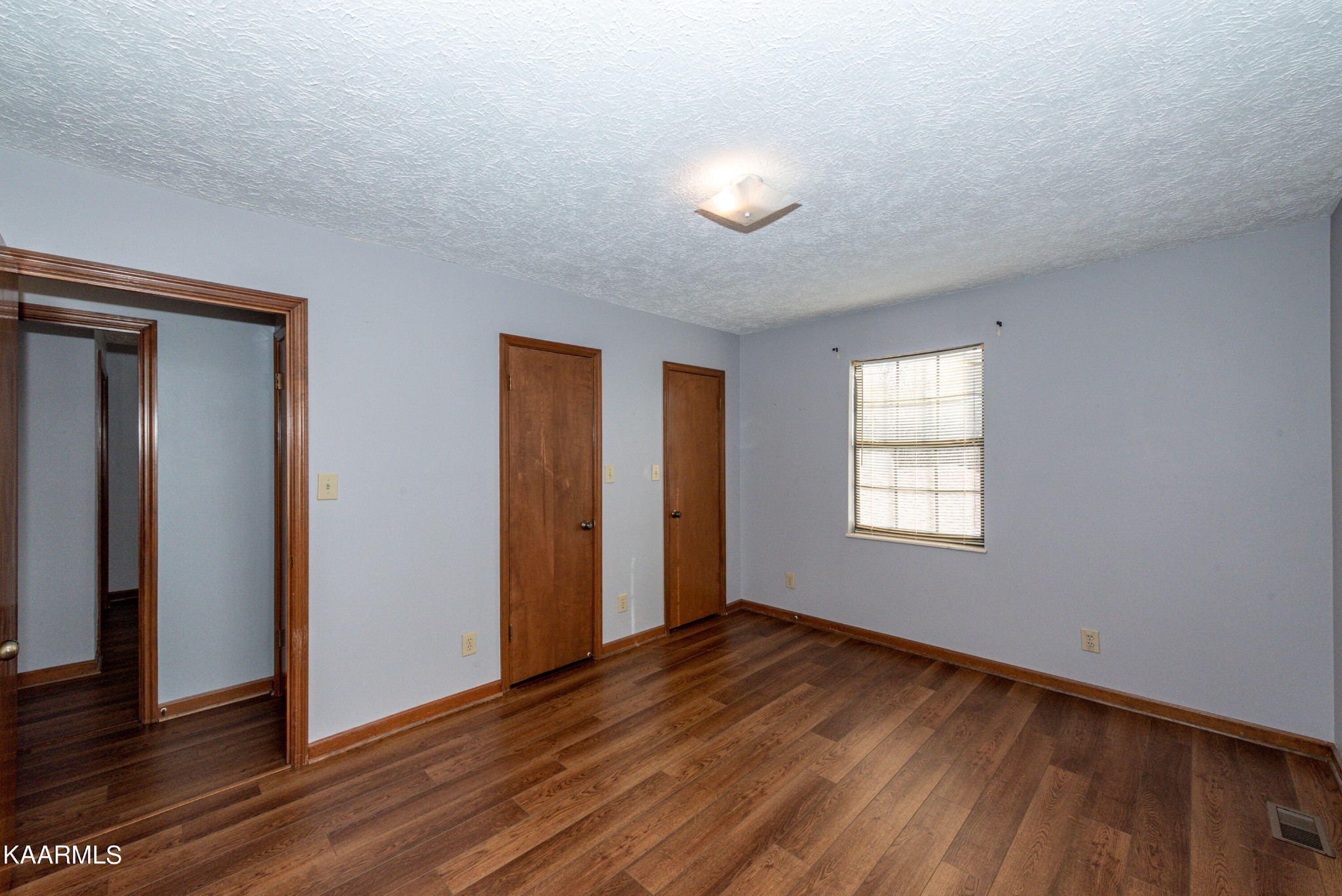 913 Mt Lebanon Road Maryville, TN 37804 - Photo 20 of 33 a view of an empty room with wooden floor and a window