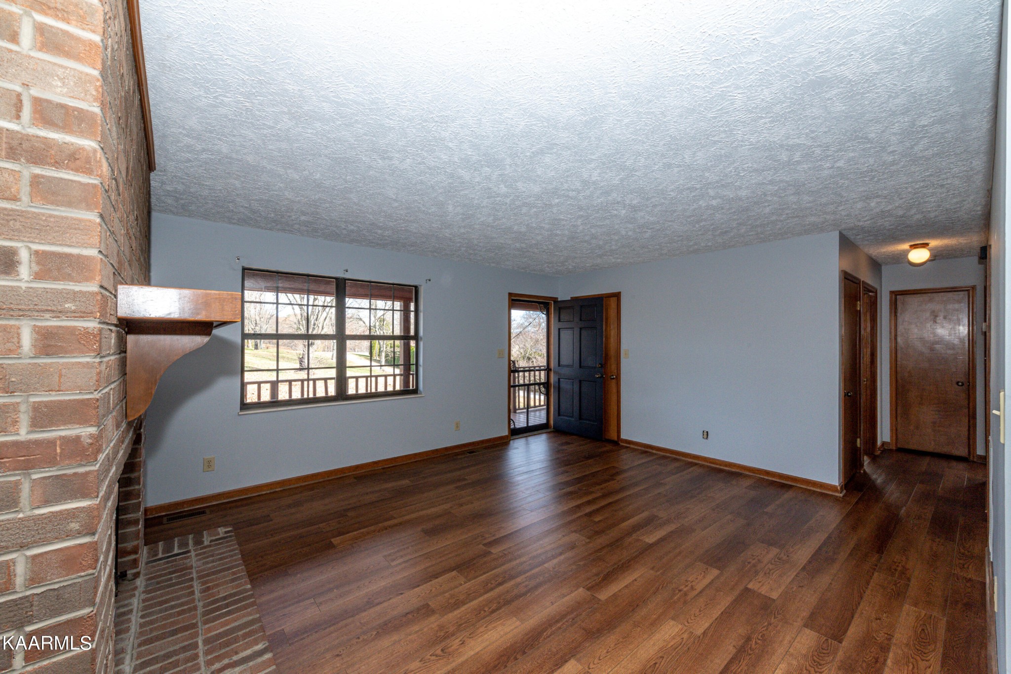 913 Mt Lebanon Road Maryville, TN 37804 - Photo 6 of 33 wooden floor in an empty room with a window