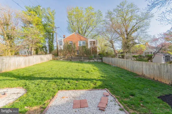 a view of swimming pool with outdoor seating and yard