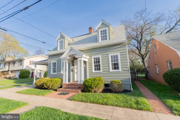 a view of a house with a yard and plants