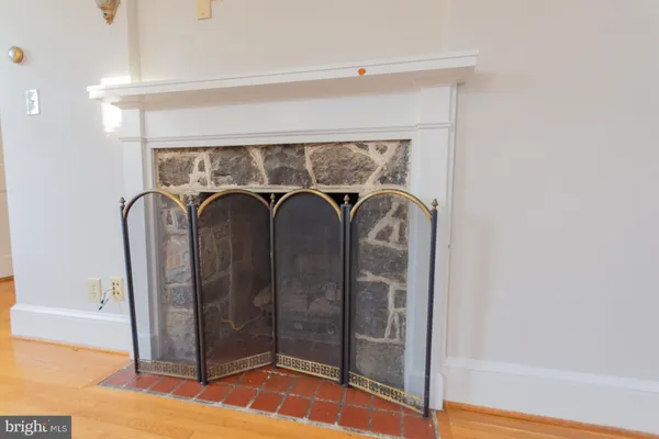 a kitchen with stainless steel appliances kitchen island granite countertop a refrigerator and a sink
