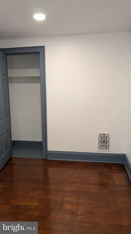 a view of room with hardwood floor