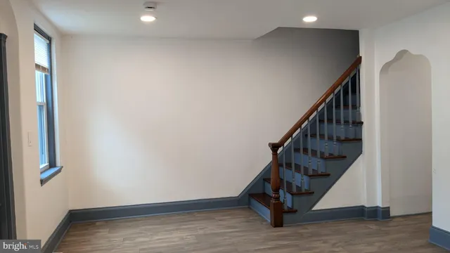 a view of entryway with wooden floor