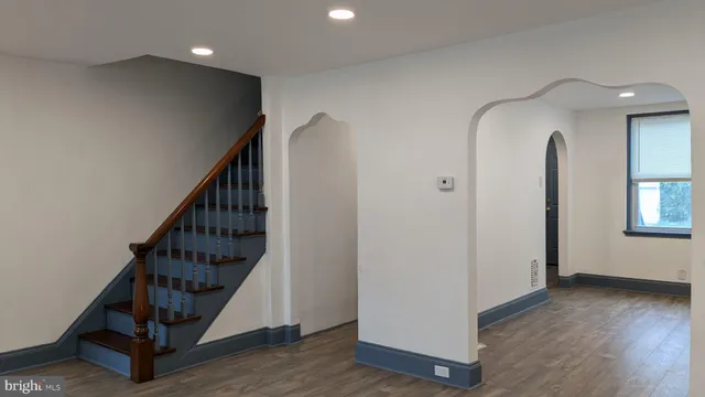 a view of an entryway with wooden floor