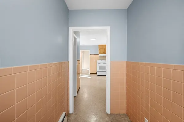 a view of a bathroom from a hallway