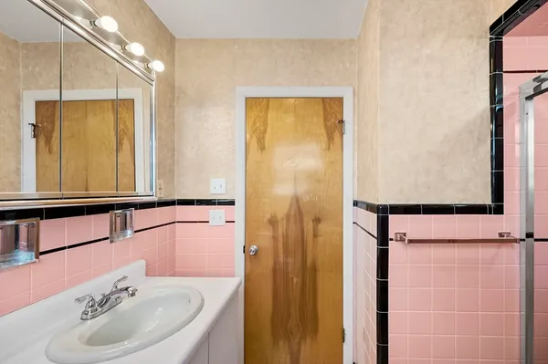 a bathroom with a sink and a mirror