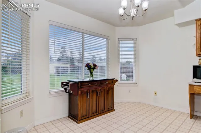 a view of a kitchen with a sink and a window