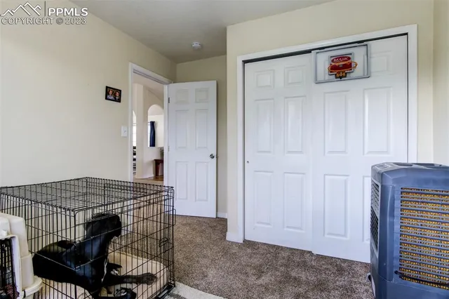 a view of a livingroom with furniture and front door