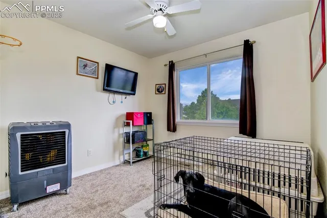 a bedroom with a bed and flat screen tv