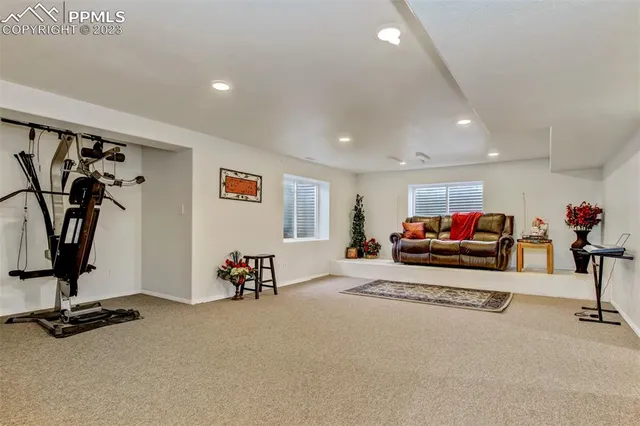 a living room with furniture gym equipment and a view of living room