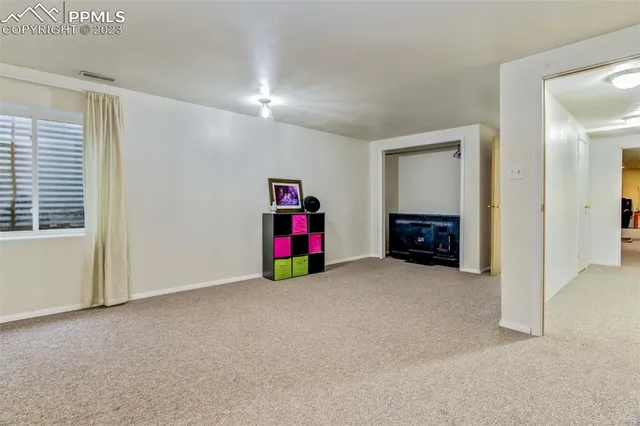 a view of a room with toys and a bathroom