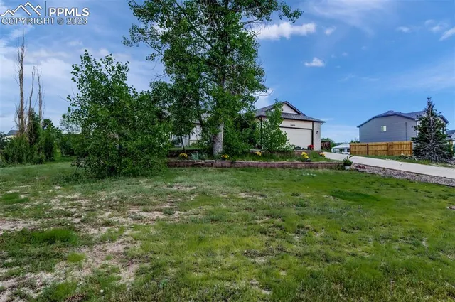 a view of outdoor space with deck and yard