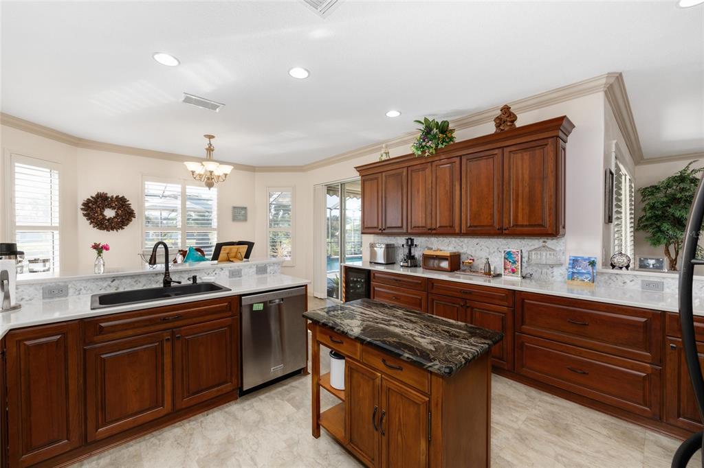 15694 Southwest 16th Avenue Road Ocala, FL 34473 - Photo 12 of 42 a kitchen with wooden cabinets and a sink